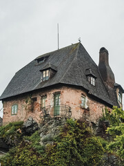 Fototapeta na wymiar Unusual old house on top of a cliff