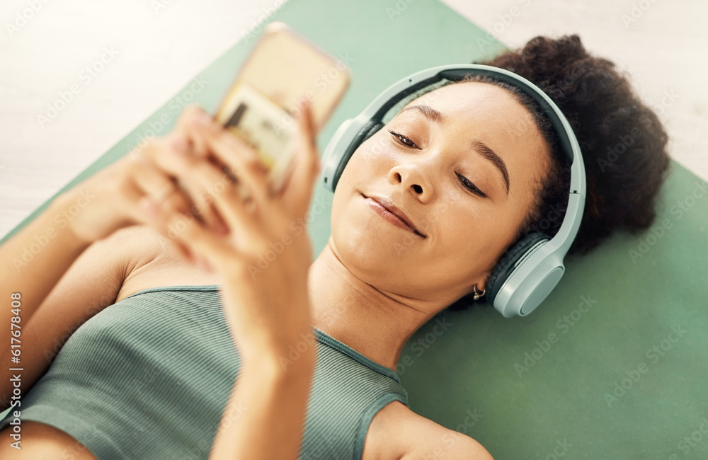 Sticker Relax, phone and yoga woman with music headphones on floor for fitness, break or texting at home from above. Workout, rest and sporty lady with smartphone and earphones for wellness, app or podcast