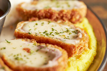 Cheese pork cutlet on a plate