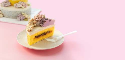 Korean sweet pumpkin rice cake decorated with pretty flowers. Isolated on pink background.	
