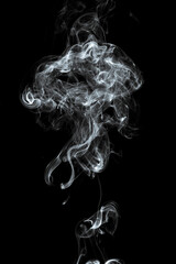 Use your imagination and dream on. Studio close up monochrome pictures of incense stick smoke and...