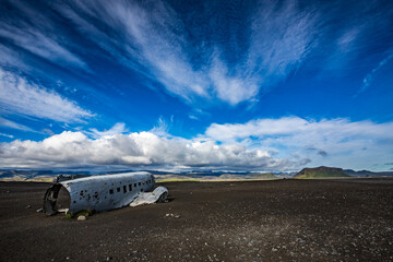 Fototapeta na wymiar Impressive summer sky over the airplane crash site in Southern Iceland, known travel and tourist destination