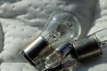 Closeup shot of small vintage lightbulbs on a bed surface