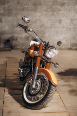 Obraz na płótnie Canvas brown old retro motorcycle in the garage