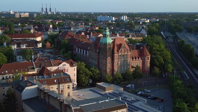 Majestic aerial top view flight 
Historic school building Berlin city Germany in Europe, summer day 2023. fly reverse drone
4K cinematic.