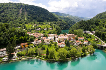 Fototapeta na wymiar Aerial drone view of Most na Soci town in Slovenia and Soca river