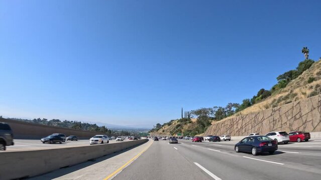 Driving along Interstate 405 in the Los Angeles metropolitan Area - driver point of view hyper lapse