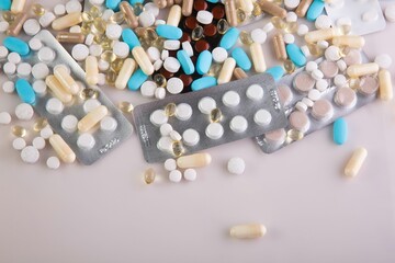 Closeup of medical pills and capsules isolated on a white background