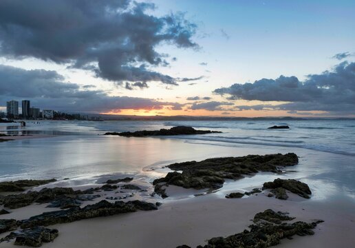 Scenic view of the Snapper Rocks under dusk sky at sunset in Coolangatta, Australia