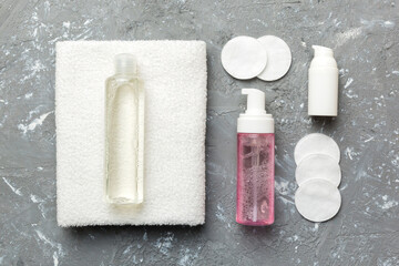 Micellar cleansing water and discs to remove cosmetics and cleanse the skin on colored background. Copy space top view