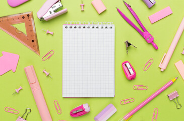 Pink school stationery on color backgroung, top view