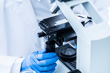 Close-up of a scientist's hand doing research in a laboratory