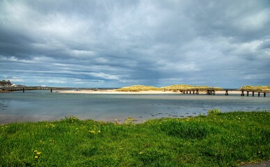 Picturesque coastal landscape featuring two bridges: the new bridge, and the old bridge