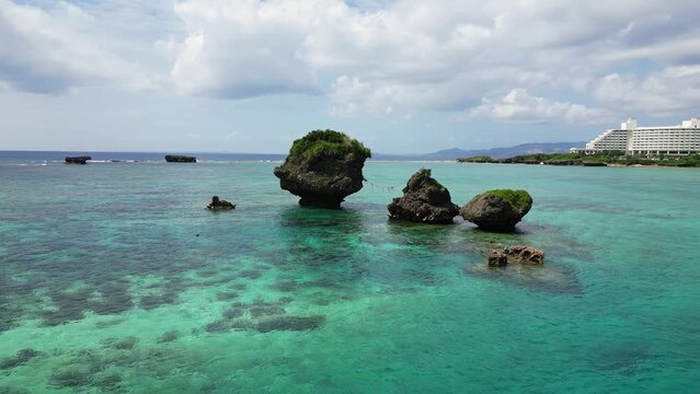 Okinawa, Japan: Aerial drone footage of the Tobera Rock near by the Manzamo coast in Naha in Okinawa in Japan in the Pacific Ocean. 
