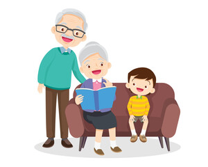 grandparents reading book with grandson