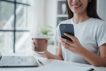 Young Asian woman university student satisfied with learning english language during online courses via laptop computer, learning online with webinar, video tutorial, internet lessons