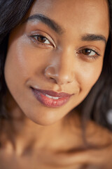 Close up portrait of beautiful multiethnic girl looking at camera