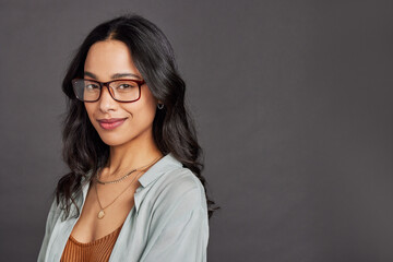 Beautiful mixed race woman with eyeglasses looking at camera