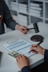 Lawsuits against Real estate agent and realtor general liability insurance businessman professional discussing and consultant with house toy model building before sign a contract with law concept