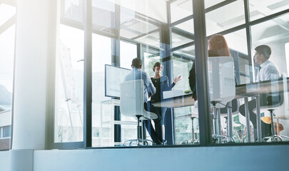Fototapeta premium Training, teaching or business people in presentation for sales report or financial analysis in office. Education, leadership or manager planning in a meeting on screen monitor in mentorship coaching
