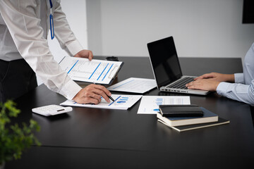 Team leader coach teach young workers explain on paper for business plan listen talkative coworker and discussing new project presentation Serious professional advisor consulting in office