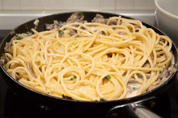Creamy mushrooms and heavy cream spaghetti