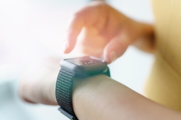 Woman workout&nbsp;with health app&nbsp;on smart watch Close-up hands