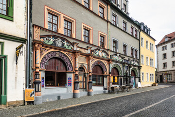 Fototapeta na wymiar Historic Theater Im Gewolbe building on the market square of Weimar, Germany
