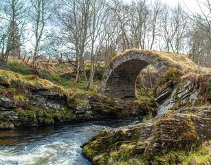 Fototapeta na wymiar a beautiful scene of some stone bridge over the stream running below