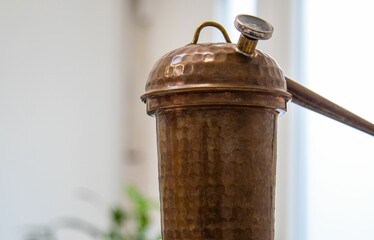 there is a small old copper pipe on the table at the kitchen