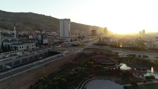 Drone view over highways and Duhok city buildings during sunset in Iraq