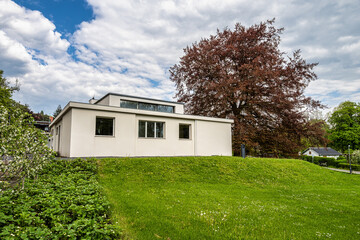 Fototapeta na wymiar Haus am Horn building in Weimar, Germany with grass lawn. Haus am Horn is the only truly Bauhaus building