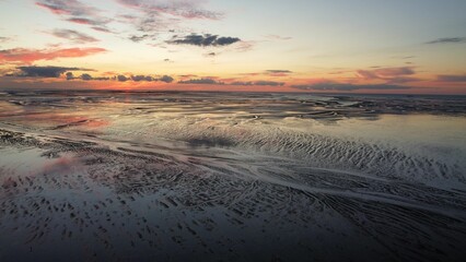 Fototapeta na wymiar Stunning view of a bright vibrant sunset sky over a sea