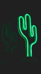 Vertical shot of a glowing neon cactus light illuminated in a dark room