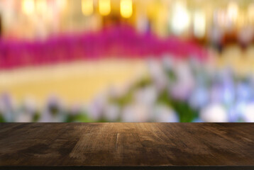 Empty wooden table in front of abstract blurred background of coffee shop . can be used for display or montage your products.Mock up for display of product.