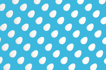 Fototapeta na wymiar White easter eggs on blue background, eggs pattern, 3d rendered