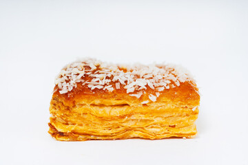 puff pastry cookies with sprinkles on a white background. baked flour muffins with coconut flakes on a light background. colorful sweets from dough for the holiday