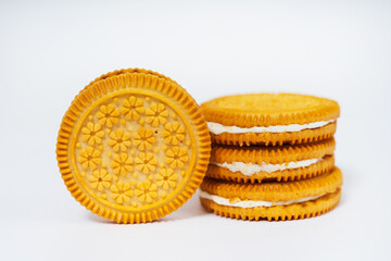 round cookies on a white background with cream. sweet cookies with filling on a light background. high-calorie flour sweets