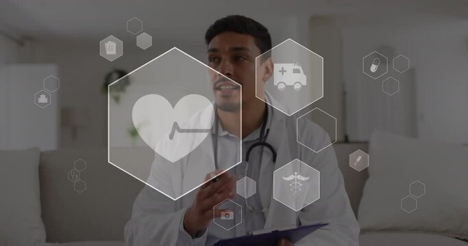 Animation of computer icon in hexagons over biracial doctor talking while looking at camera