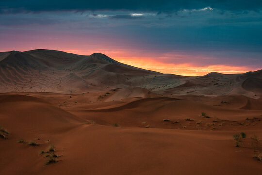 Sunset in Merzouga in the Sahara Desert, Morocco. Merzouga is a small village in southeastern Morocco, about 35km (22 miles) southeast of Rissani, about 55km (34 miles) from Erfoud and about 50km (31 © noodles79
