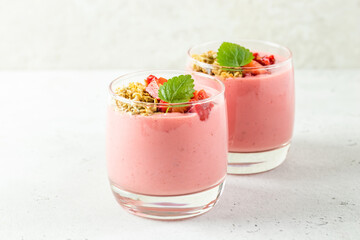 Creamy thick berry yogurt dessert in glasses. Copy space, flat lay.