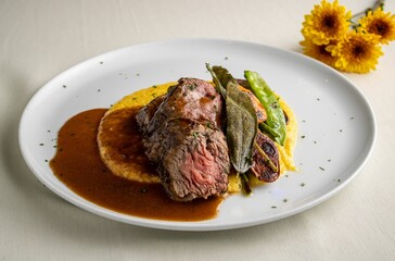 Appetizing platter of gourmet meat served in a fine-dining plate