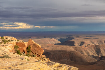 Scenic aerial vistas of desert landscape and canyons of Valley of the Gods seen from remote cliff Muley Point near Mexican Hat, San Juan county, Utah, USA. Monument valley seen in the distance