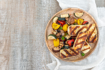 Grilled colorful vegetable : bell pepper, zucchini, eggplant with halluomi cheese on a plate