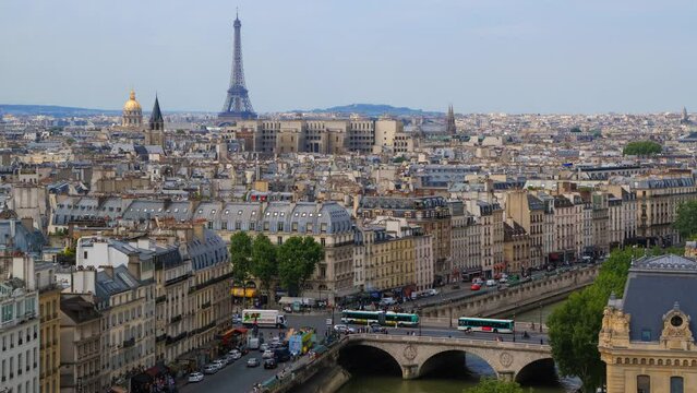 Timelapse of the Eiffel Tower and the cityscape of Paris during the daytime