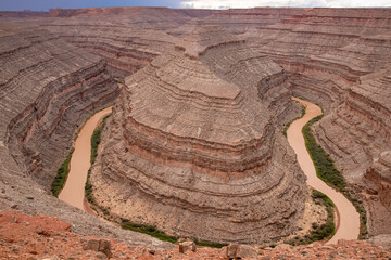 Panoramic aerial view on the convolutions of San Juan River meandering through a horseshoe bend at...