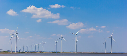 Fototapeta premium Wind turbines at the coast in Termunterzijl, Netherlands