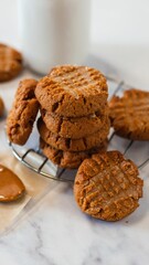 Delicious assortment of freshly-baked cookies are displayed on a metal rack