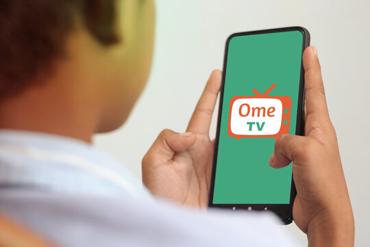pringsewu, Lampung; June 28, 2023; man playing OME TV Video chat mobile app on logo, clipping path isolated in turquoise color