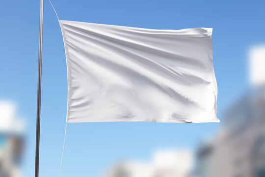 white flag against blue sky and clouds, mockup